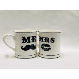 Mr. Mustache and Mrs. Lips cups in white ceramic with a black mustache and red lips design